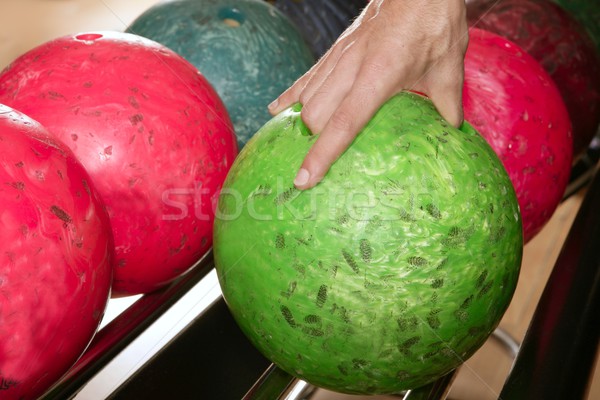 Bowling ball in player man hand Stock photo © lunamarina