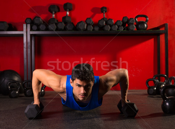 push-up strength man hex dumbbells workout at gym Stock photo © lunamarina