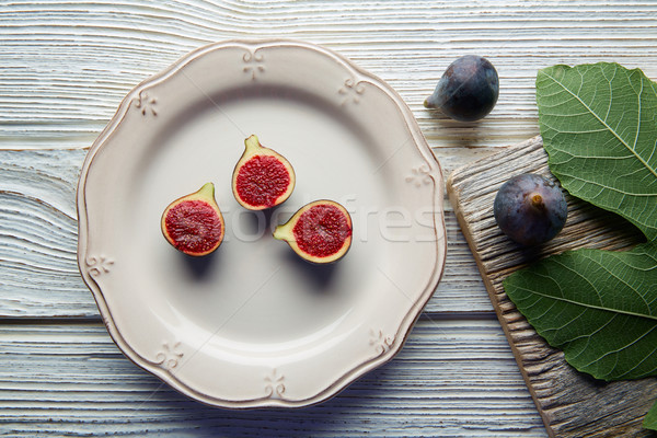 figs raw cutted fig fruits on white plate on white Stock photo © lunamarina