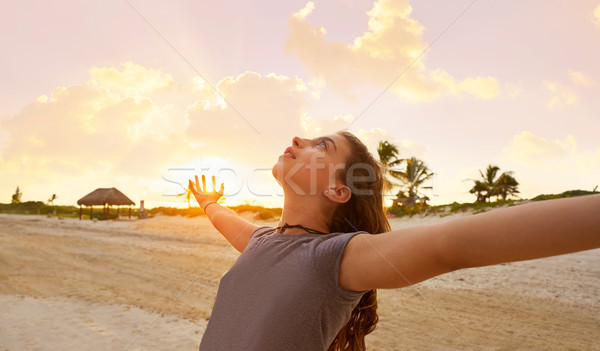 Open arms girl at sunset caribbean beach Stock photo © lunamarina