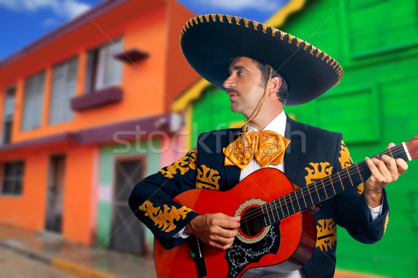 Charro Mariachi playing guitar Mexico houses Stock photo © lunamarina