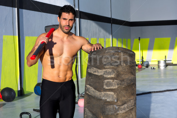 Crossfit sledge hammer man at gym relaxed Stock photo © lunamarina