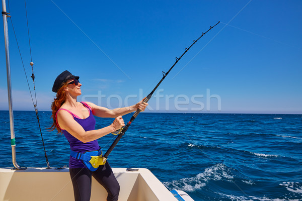 Stock photo: Beautiful woman girl fishing rod trolling in boat