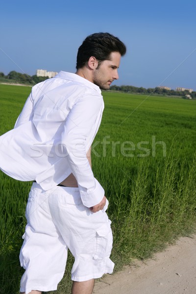 Young man outdoor running in meadow Stock photo © lunamarina