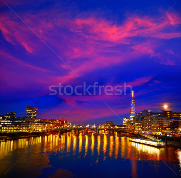 Londen skyline zonsondergang theems rivier reflectie Stockfoto © lunamarina