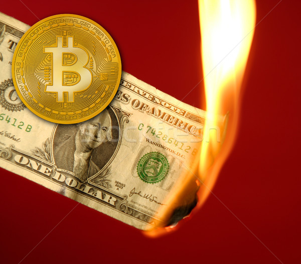 Stock photo: Bitcoin BTC versus dollar burning in fire
