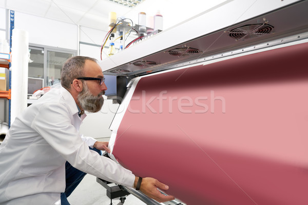 Espertise man in transfer printing industry plotter Stock photo © lunamarina