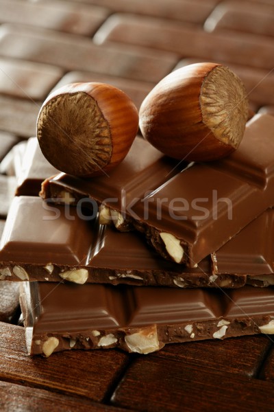 Hazelnuts and chocolate in brown enviroment Stock photo © lunamarina