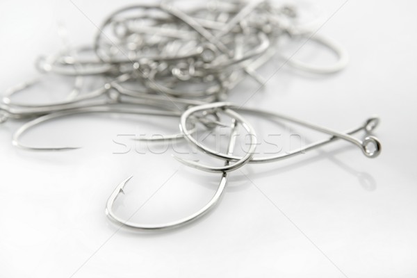 fishing hooks over white background Stock photo © lunamarina