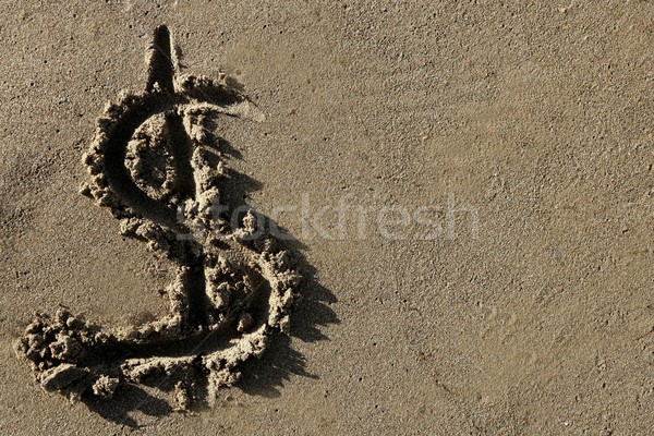 American currency  dollar sign on the beach sand Stock photo © lunamarina
