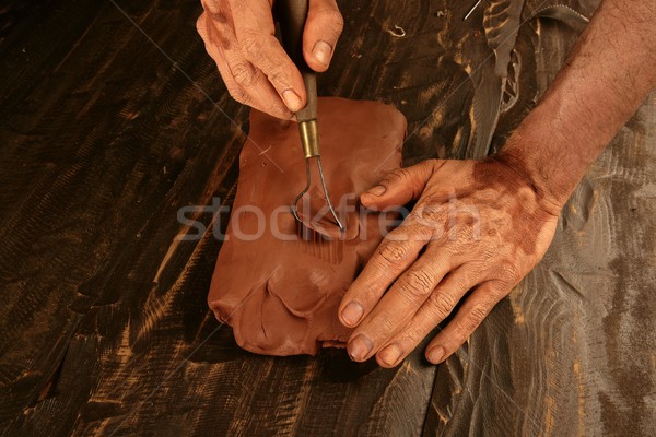 artist man hands working red clay for handcraft Stock photo © lunamarina