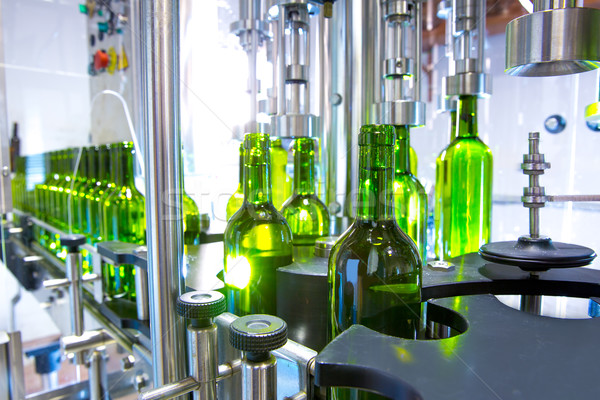 white wine in bottling machine at winery Stock photo © lunamarina
