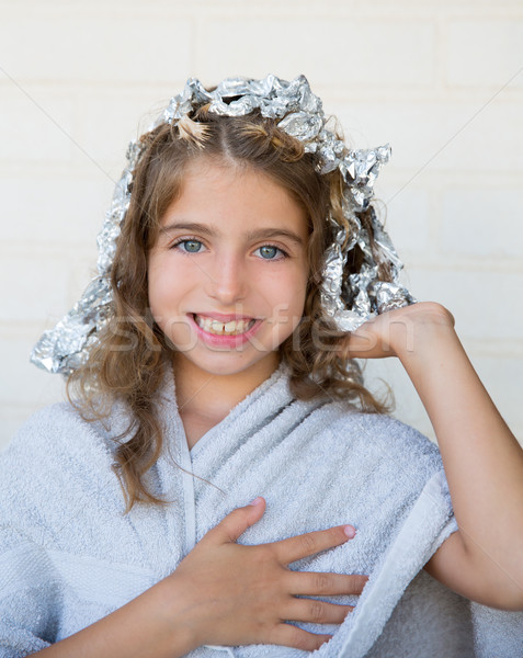 Funny kid girl smiling with his dye hair with foil Stock photo © lunamarina