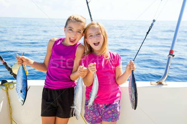 Boldog tonhal gyerek lányok halfajok zsákmány Stock fotó © lunamarina