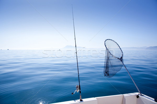 boat fishing rod and landing net in sea Stock photo © lunamarina