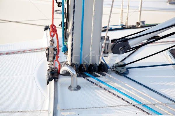 Detail of sailboat mast bottom with ropes Stock photo © lunamarina