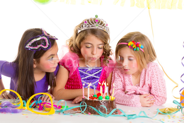 children happy girls blowing birthday party cake  Stock photo © lunamarina