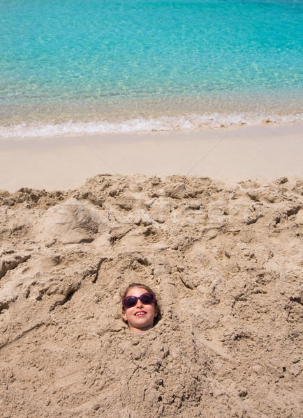 смешные девушки играет похороненный песчаный пляж улыбаясь Сток-фото © lunamarina