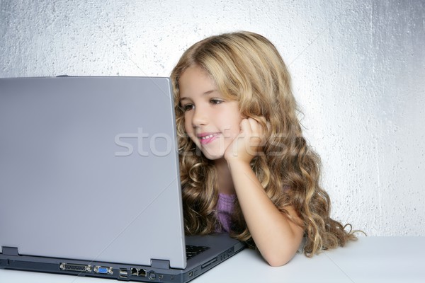 Student little school girl on laptop compute Stock photo © lunamarina