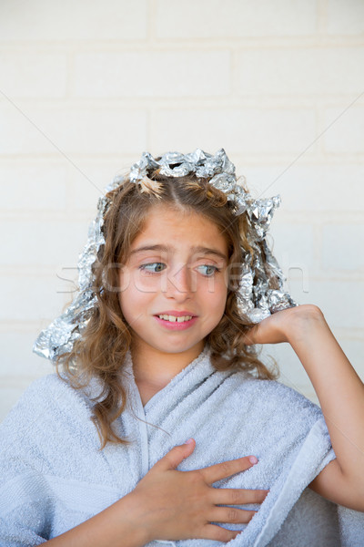 Funny kid girl scared about his dye hair with foil Stock photo © lunamarina