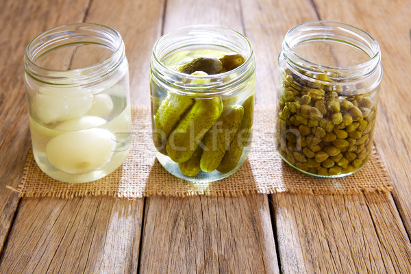 bottled pickles as capers onion and cucumbers Stock photo © lunamarina