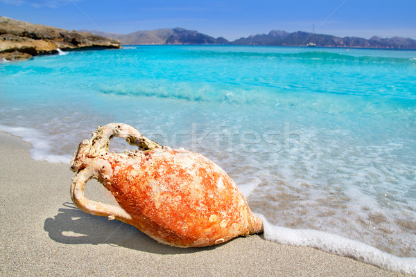 Alcudia Beach Mallorca with roman amphora Stock photo © lunamarina