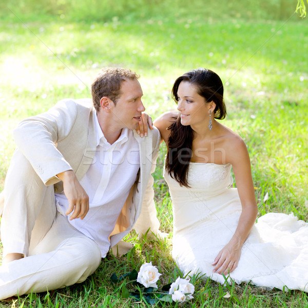 Pár friss házasok ül park fű zöld fű Stock fotó © lunamarina