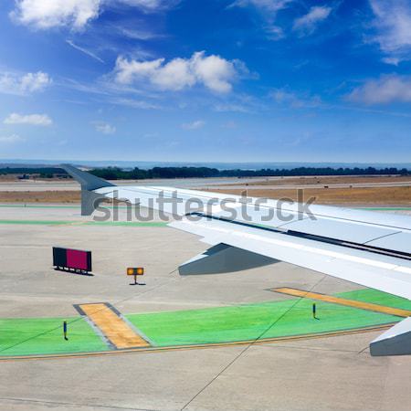 Airplane wing leaving the airport Stock photo © lunamarina