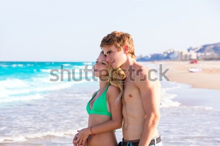 Daughter and mother on the beach sun screen moisture Stock photo © lunamarina