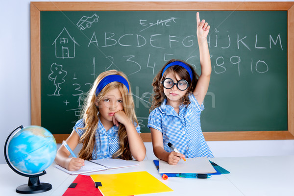 clever nerd student girl in classroom raising hand Stock photo © lunamarina