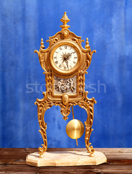 ancient vintage golden brass pendulum clock Stock photo © lunamarina