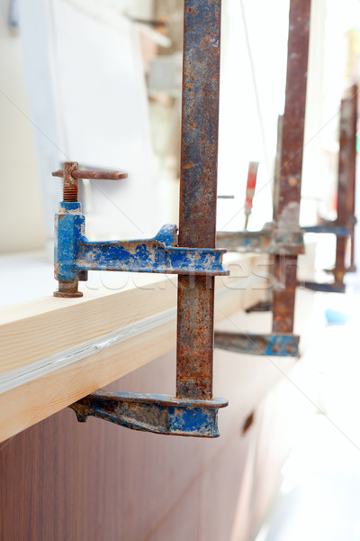 Carpenter screw clamp tool pressing wood slats Stock photo © lunamarina