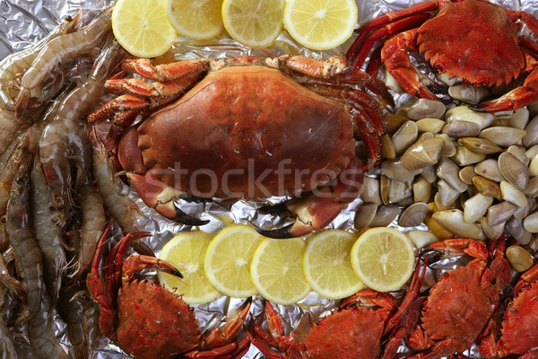 Crabs tellin shrimp clams and lemon Stock photo © lunamarina