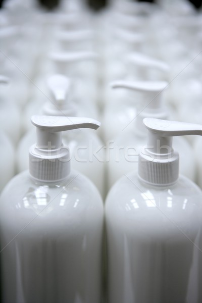 White plastic soap bottles in rows assembly line Stock photo © lunamarina