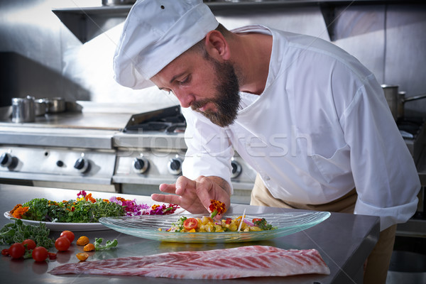 Chef garnishing flower in ceviche dish Stock photo © lunamarina
