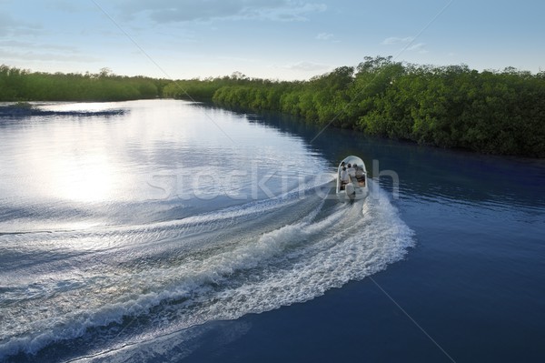 Boat ship wake prop wash sunset lake river Stock photo © lunamarina