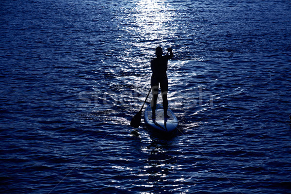 Stand up surf ragazza cielo acqua Foto d'archivio © lunamarina