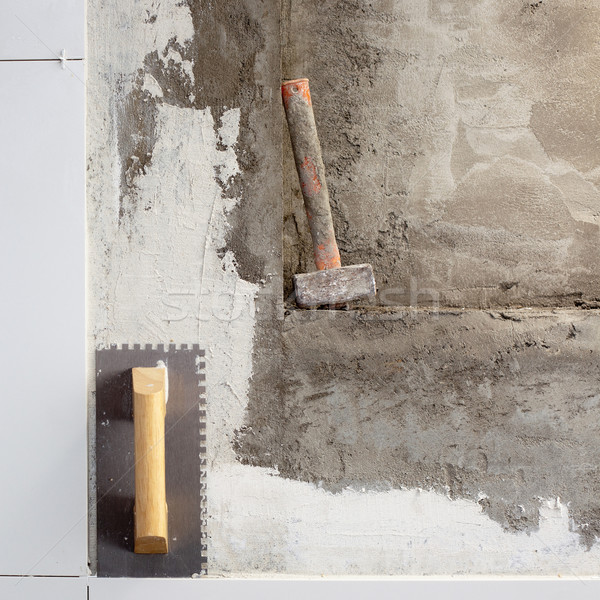 Stock photo: construction tools notched trowel and hammer