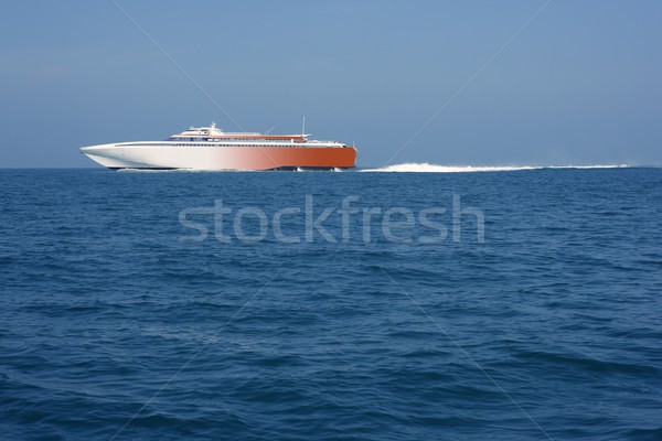 fast ferry sailing blue ocean sea white wake Stock photo © lunamarina
