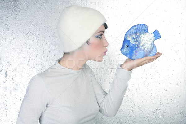 woman profile holding fish kissing expression Stock photo © lunamarina