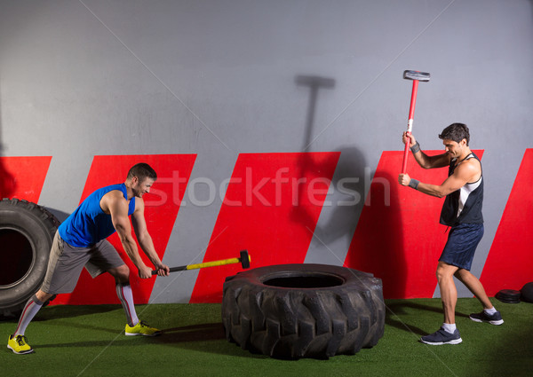 Sledgehammer Tire Hits men workout at gym Stock photo © lunamarina