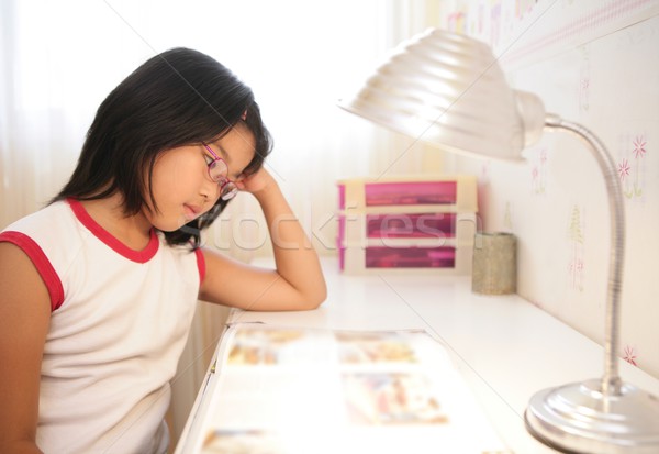 Stock photo: asian little girl studying at home