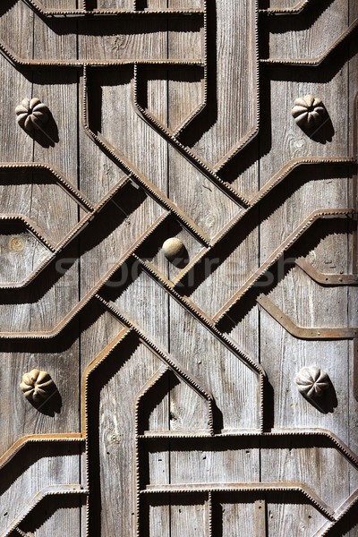 old aged wooden door iron handcraft deco Stock photo © lunamarina