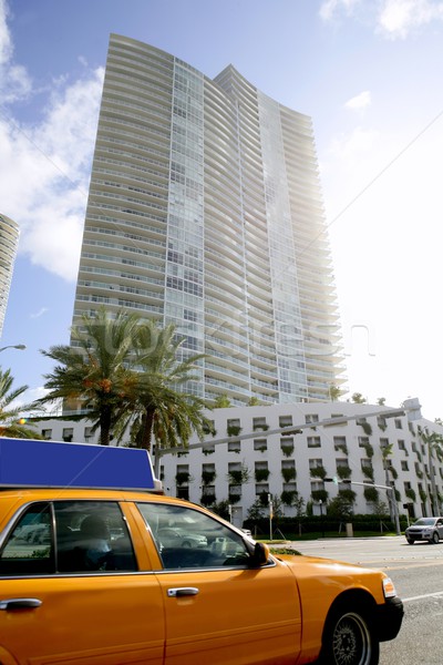 Yellow cab with Miami Beach Florida buildings Stock photo © lunamarina
