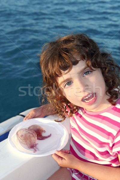 Girl with two jellyfish in white dish boat blue sea Stock photo © lunamarina