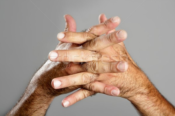 Włochaty człowiek strony szary ręce Zdjęcia stock © lunamarina