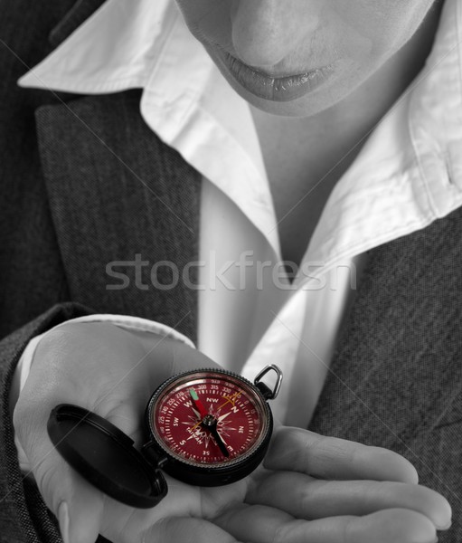 Stock photo: business woman with compass in her hand