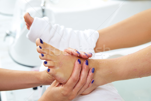 foot scrub pedicure woman leg in nail salon Stock photo © lunamarina