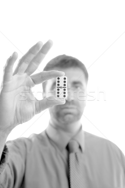 Businessman holding domino tile on hand Stock photo © lunamarina