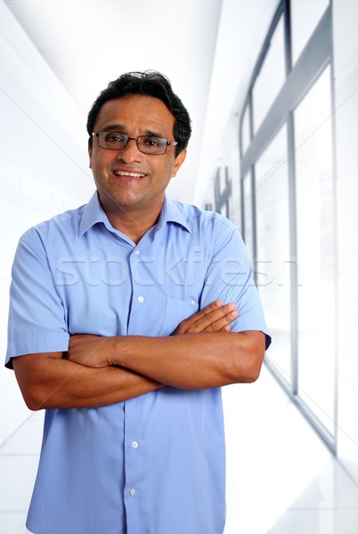 indian latin businessman glasses blue shirt in office Stock photo © lunamarina